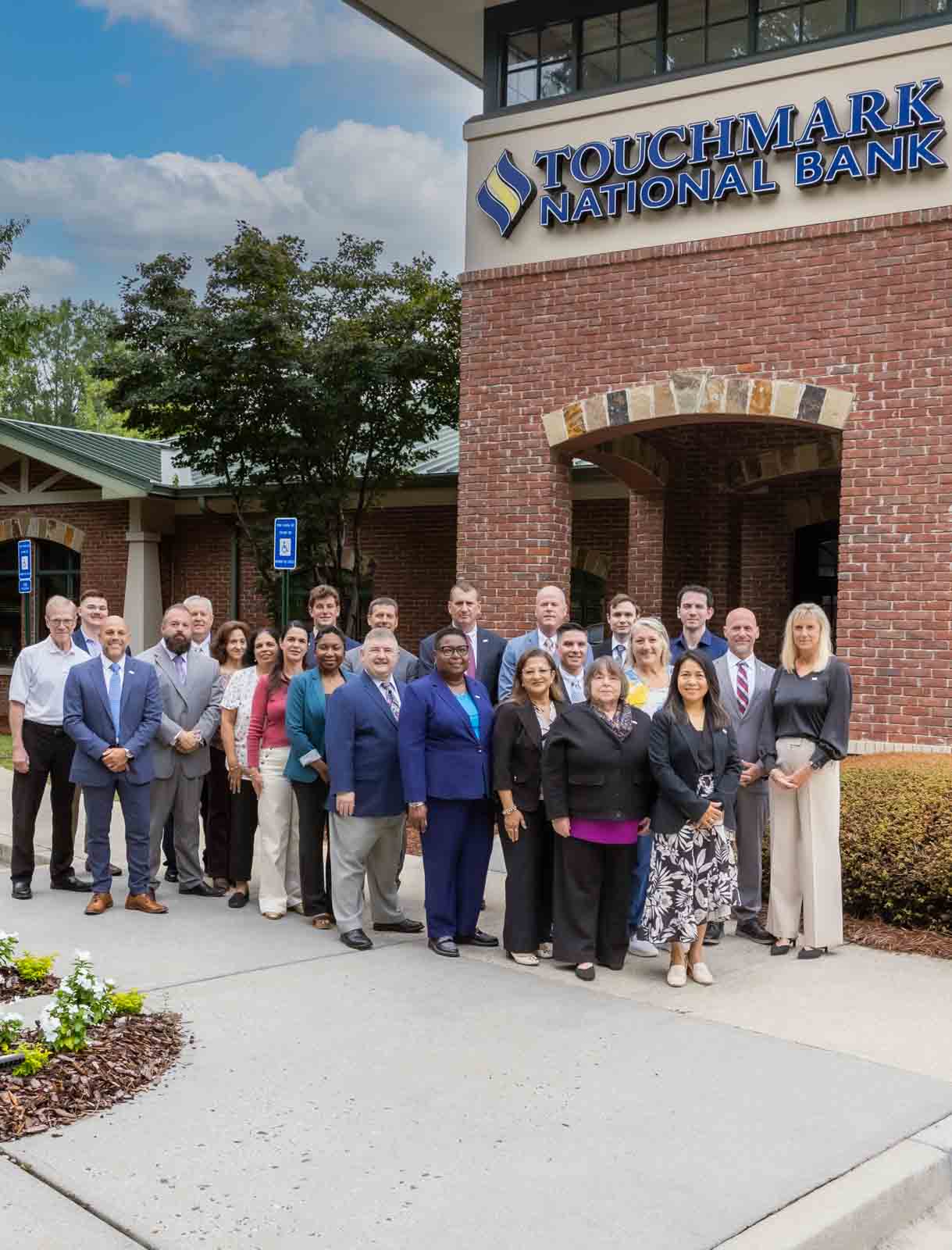 Touchmark National Bank team outside the bank